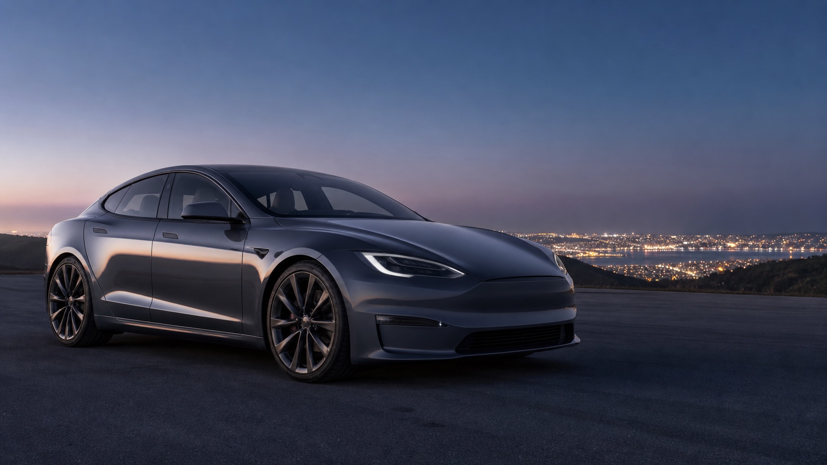 Blue electric luxury sedan on a mountain road for the Tesla Model S guide